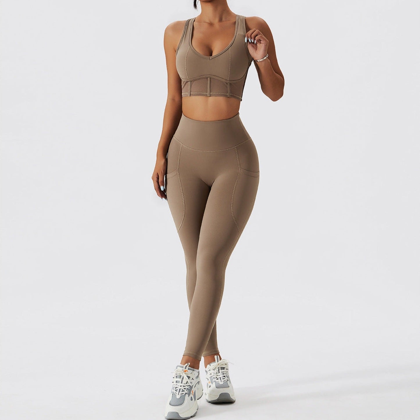Fitness model wearing a tan matching set from Vibras Activewear.