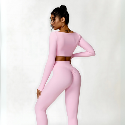 Back photograph of pink Valentina set with long sleeve crop top and high-waisted, rushed leggings from Vibras Activewear.