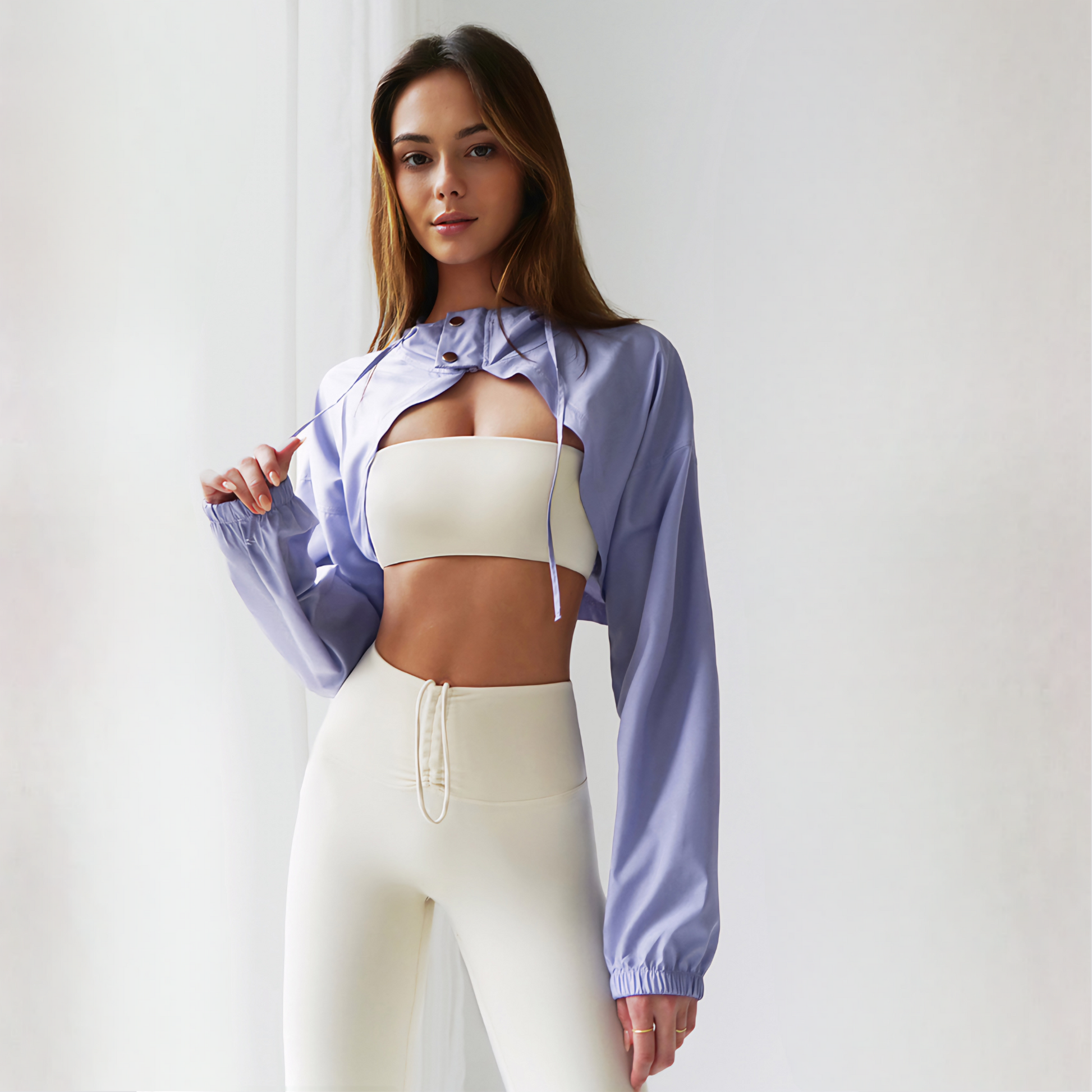Fitness model wearing  the ELLA Jacket in lavender from vibras activewear.