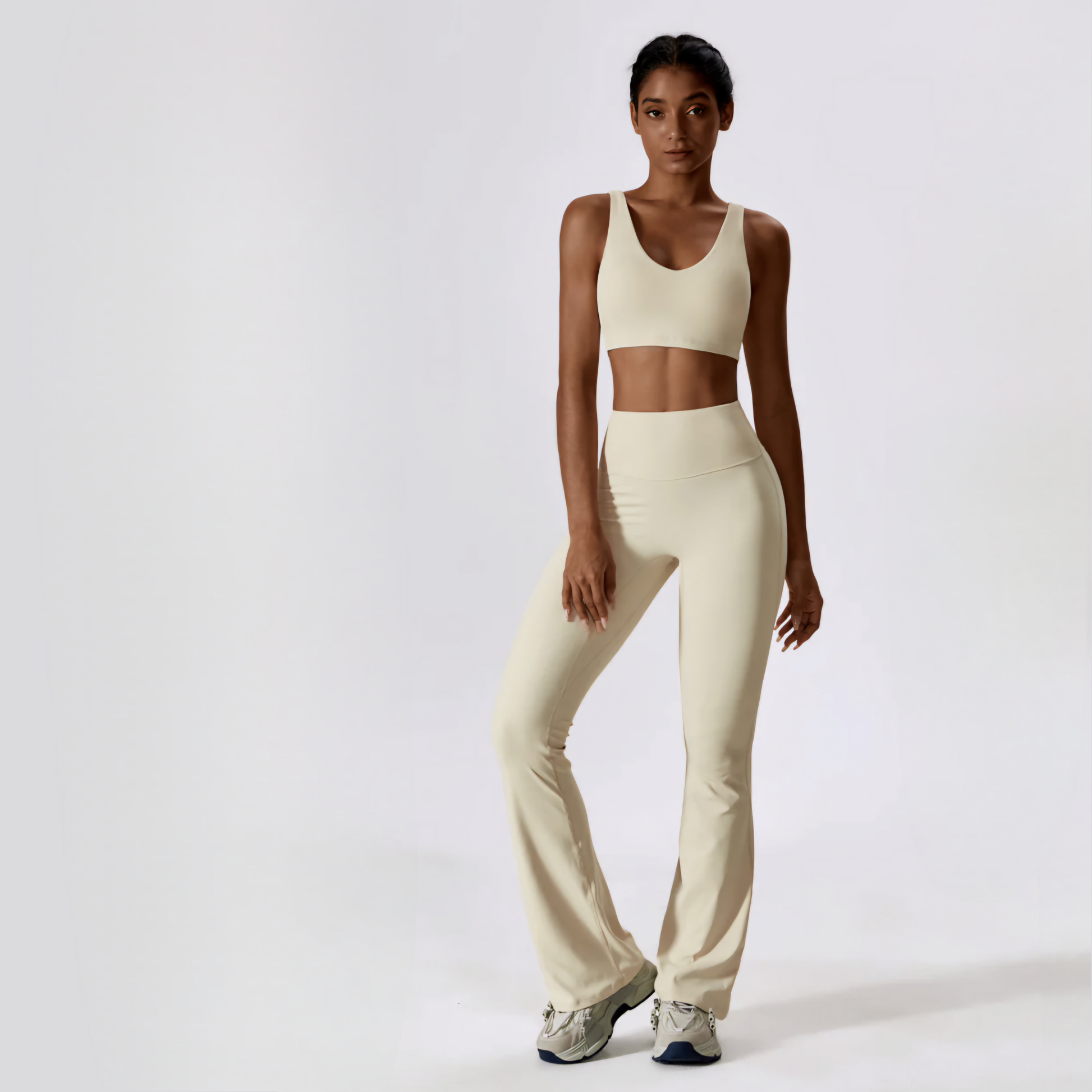 Model posing in the natalia set in cream from vibras activewear.