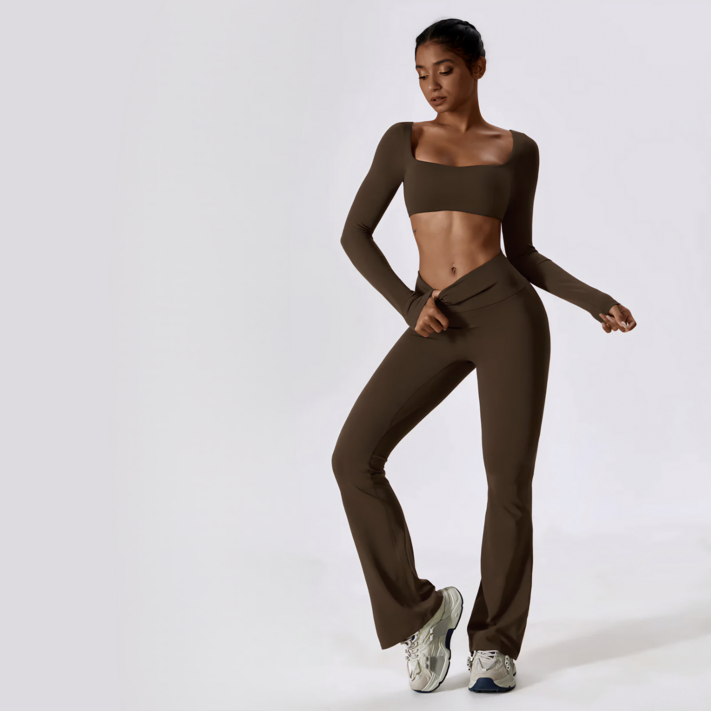 Fitness model wearing the body sculpting, chic and sexy Anastasia matching workout set in the colour brown from Vibras Activewear.