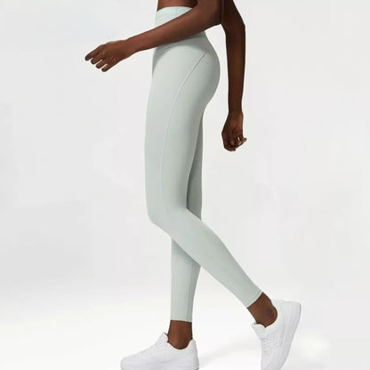 SIDE PHOTO OF FITNESS MODEL WEARING A MINT COLOURED, BUTT LIFTING, TUMMY CONTROL, HIGH WAISTED  LEGGINGS FROM VIBRAS ACTIVEWEAR.