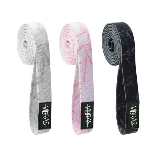 a set of three marble long resistance bands for workout in three different colors white, pink and black on a white background.