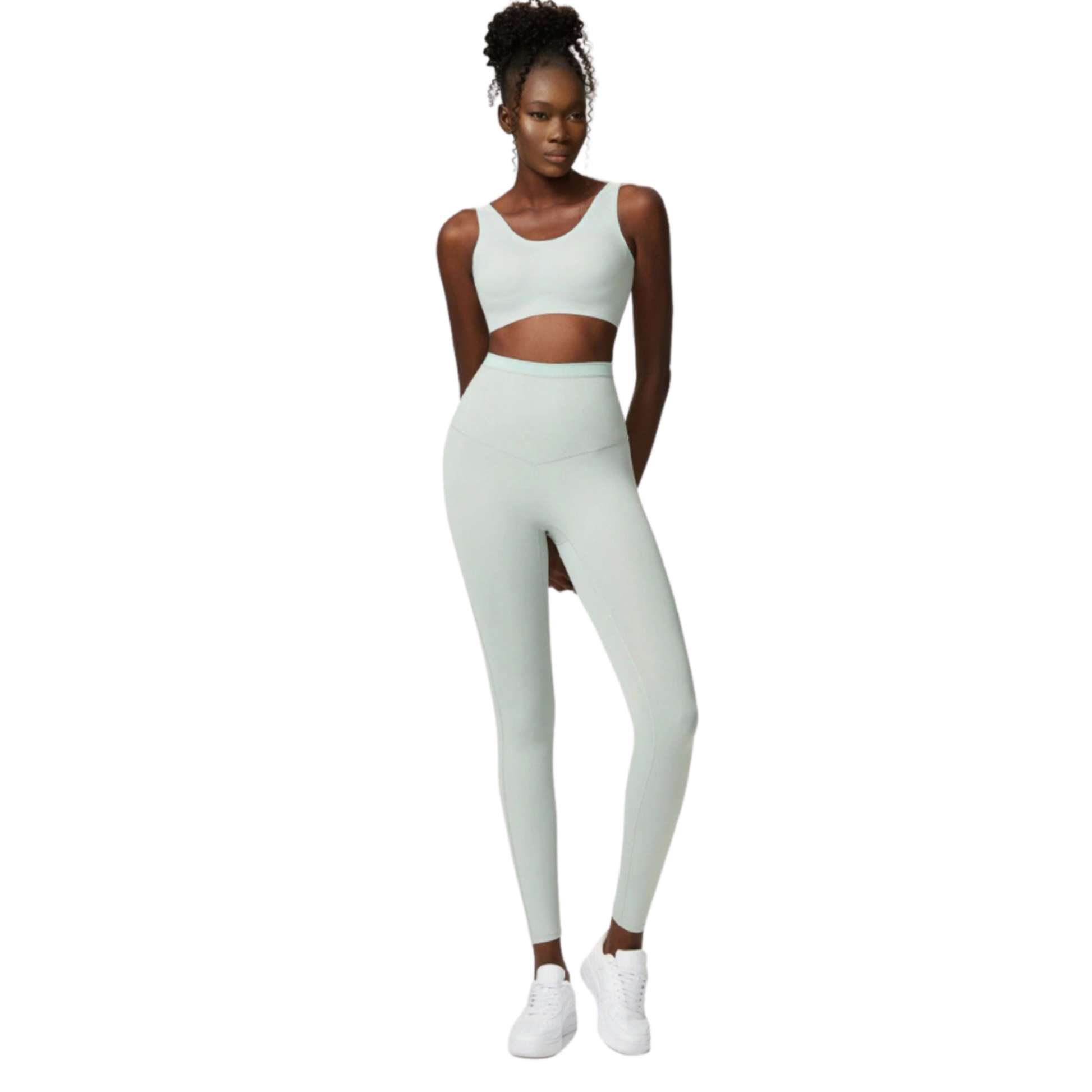 African American model wearing a mint coloured, high waisted, squat proof matching workout set from Vibras Activewear.