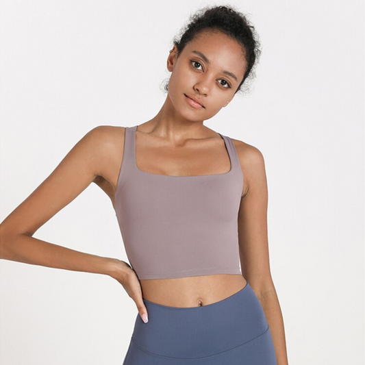 MODEL WEARING A MAUVE, SQUARED NECK CROP TOP FROM VIBRAS ACTIVEWEAR