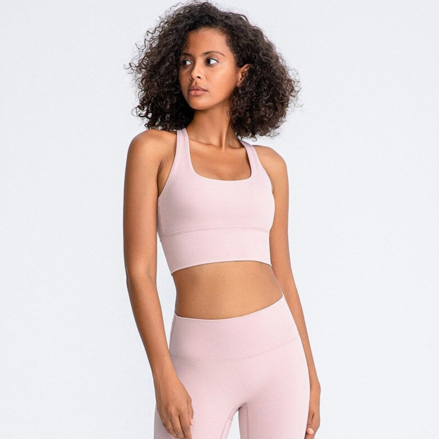 fitness model wearing a haltered gym sports bra from Vibras Activewear.