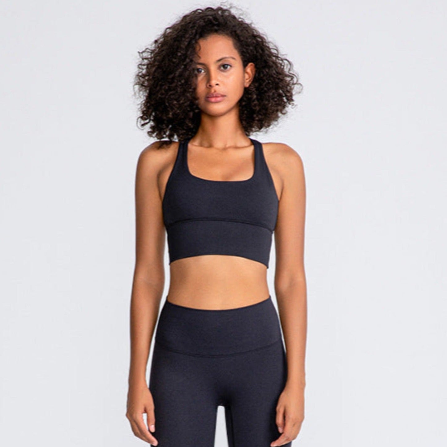 woman wearing a black sports bra for working out