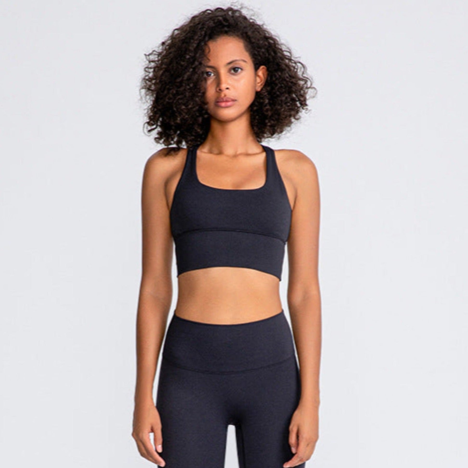 woman wearing a black sports bra for working out